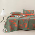 Close-up view of ginkgo leaf orange floral blanket showing edge details and texture