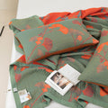 Detailed close-up of pillowcases and blanket with magazine, showing both sides of fabric