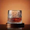 glacier-cut whiskey glass with rich amber drink