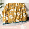 Floral patterned blanket draped over a couch with text 'The best choice for gift' on a light background.