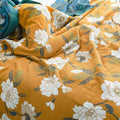 Floral patterned fabric with white flowers on a mustard yellow background