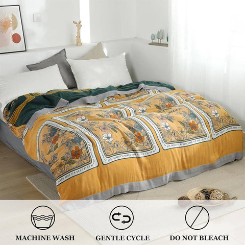 Care instructions icons for Golden Romance Boho Throw Blanket: machine wash, gentle cycle, do not bleach.