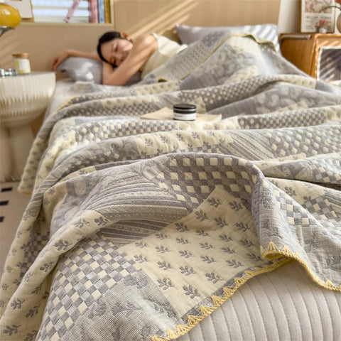 Woman sleeping under gray patchwork jacquard summer quilt