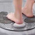 Foot cleaning on gray anti-slip shower mat