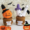 Crochet pumpkin and ghost ornaments in festive potted plant design