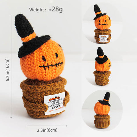 Crocheted pumpkin character with a witch hat and dimensions on a white background