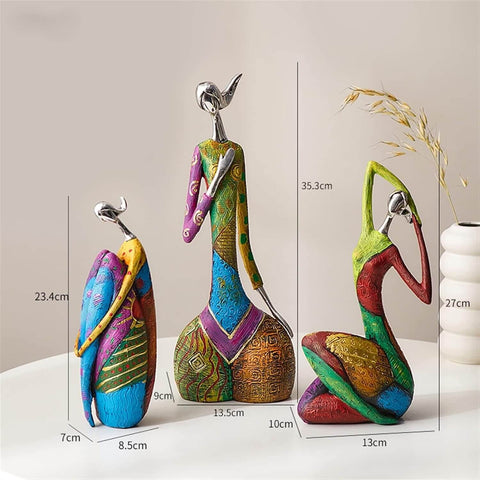 Colorful ceramic bird figurines with measurements on a neutral background
