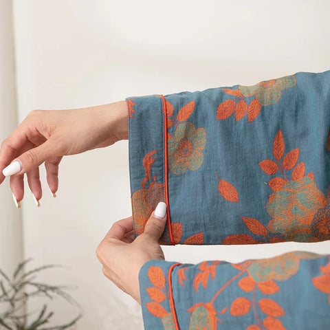 Woman relaxing in blue-orange floral cotton bathrobe
