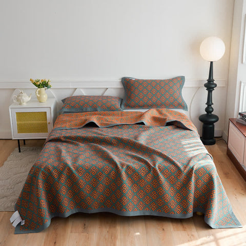 Full bedroom view with Japanese triple gauze summer quilt neatly laid on bed