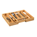 Wooden cutlery organizer with silverware on a white background
