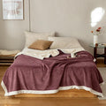Kumo Harmony Blanket in Purple White on bed – Japanese Milk Velvet Tradition