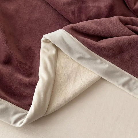 Folded Kumo Harmony Blanket in Purple White showing milk velvet texture