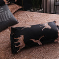 Folded duvet cover and pillow with black and leopard design in bedroom setup