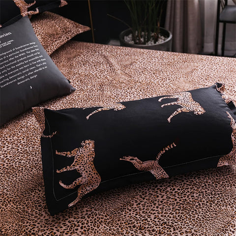 Folded duvet cover and pillow with black and leopard design in bedroom setup