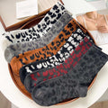 6 Leopard Print Sock Variants Displayed on Round Tray