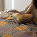 Lightweight breathable quilt styled in neutral interior setting