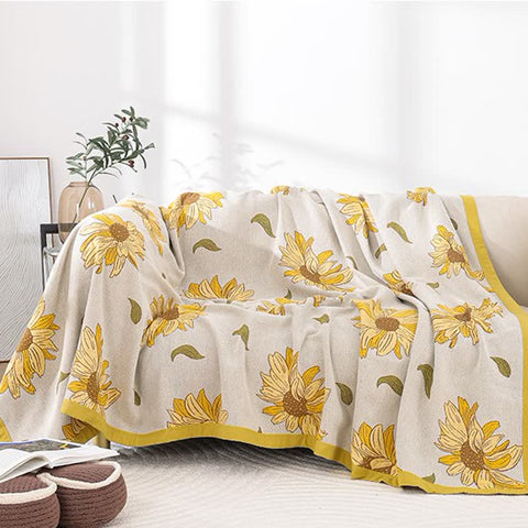 Lightweight cotton gauze blanket styled as summer sofa throw