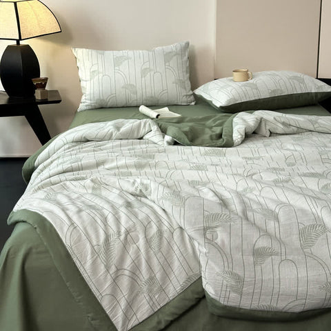 Overhead angle of lightweight green summer quilt set with pillows