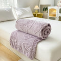 Lilac purple butterfly embossed blanket styled for minimalist bedroom