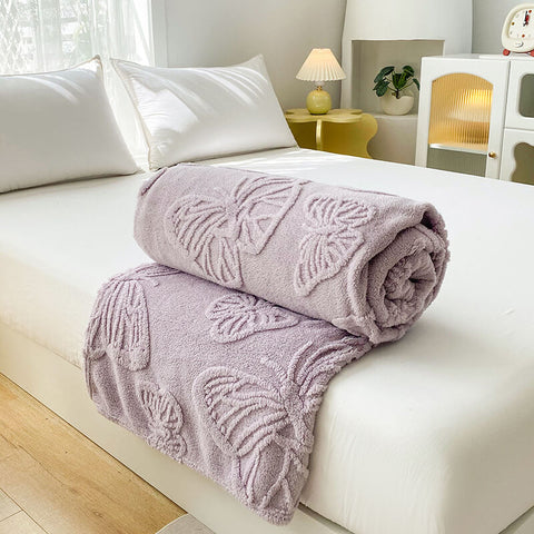 Lilac purple butterfly embossed blanket styled for minimalist bedroom