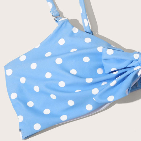 Close-up of bikini top showing white polka dots and soft stretch fabric