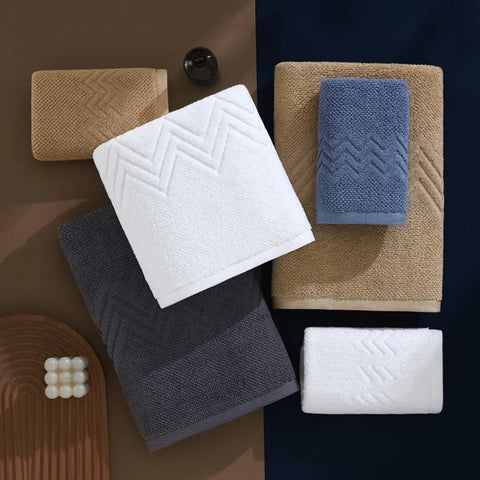 Flat-lay of hotel-style cotton towels in four colors