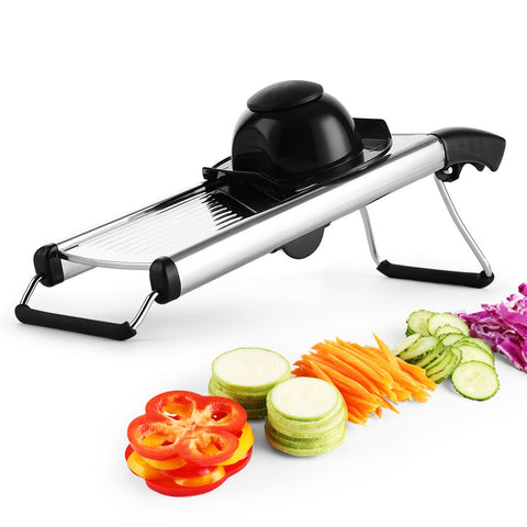 Mandoline slicer with colorful vegetables neatly sliced

