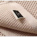 Close-up of fabric tag on textured honeycomb towel