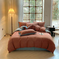 Milano houndstooth brick red and light blue double gauze cotton bedding set with duvet cover on bed