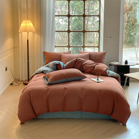 Milano houndstooth brick red and light blue double gauze cotton bedding set with duvet cover on bed