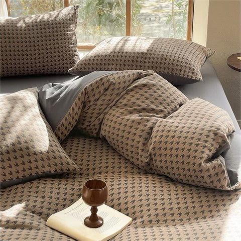 Brown and gray Milano houndstooth cotton bedding set with duvet cover arranged on bed