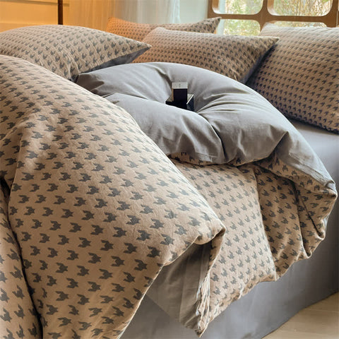 Milano houndstooth brown and gray double gauze cotton bedding set styled with duvet cover and pillow shams