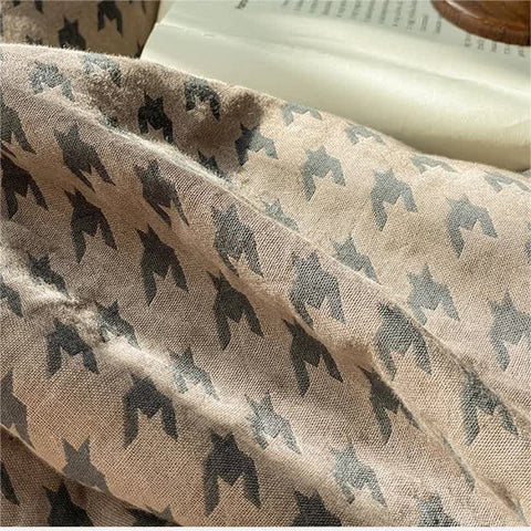 Close-up of Milano houndstooth brown and gray cotton fabric pattern