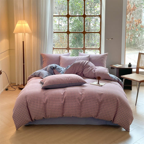 Milano houndstooth pink and gray double gauze cotton bedding set with duvet cover on bed