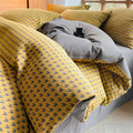 Close-up of Milano houndstooth yellow and gray cotton bedding set with soft duvet cover