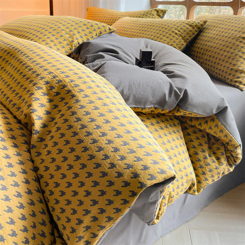Close-up of Milano houndstooth yellow and gray cotton bedding set with soft duvet cover