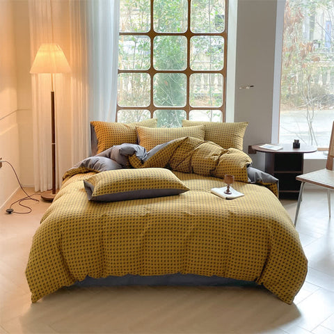 Milano houndstooth yellow and gray double gauze cotton bedding set with duvet cover on bed