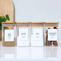 Organized spice jars with bamboo lids and printed minimalist labels