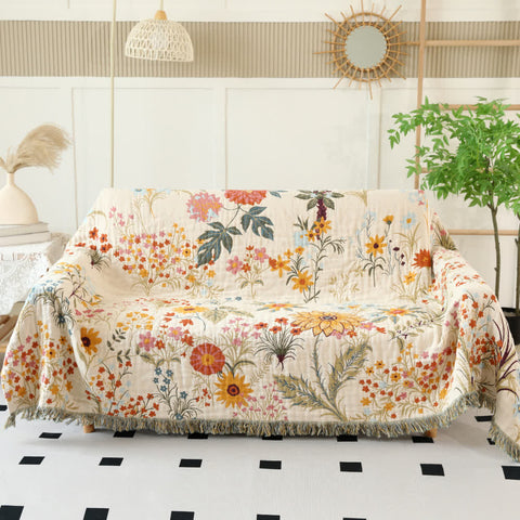 Reversible floral cotton couch cover blanket on living room sofa