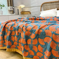 Cozy cotton quilt with bold leaf pattern in modern bedroom
