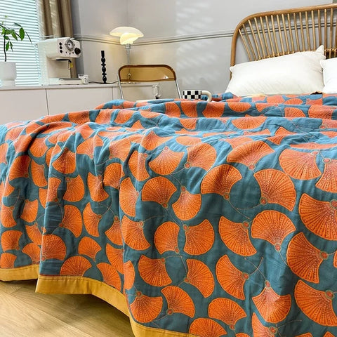 Cozy cotton quilt with bold leaf pattern in modern bedroom