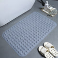  Gray rectangular anti-slip mat beside bath slippers