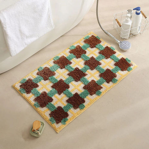 Retro Moroccan bath mat with blue and red geometric pattern near a bathtub