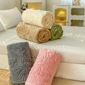 Rolled butterfly throw blankets in beige, green, gray, and pink for couch or bed layering