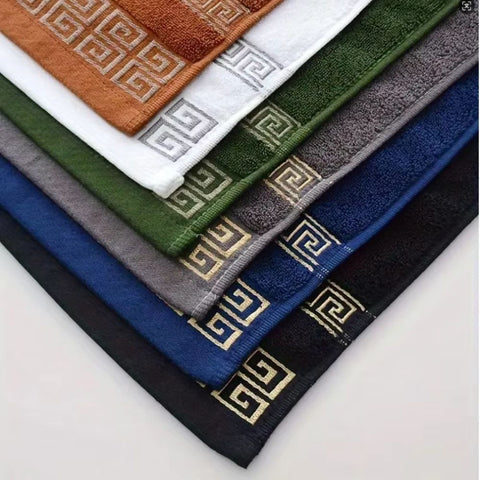 Mixed color towel sets with Greek borders on display grid