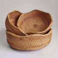 Nested handwoven rattan baskets with natural texture