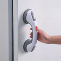 Bathroom safety handle with ergonomic grip installed on shower wall

