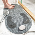 Gray textured shower mat with a handheld showerhead on a bathroom floor.