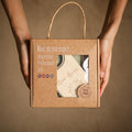 Baby towel and brush set presented in kraft gift box packaging