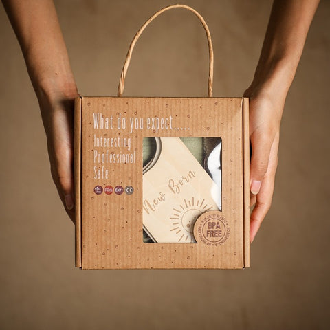 Baby towel and brush set presented in kraft gift box packaging